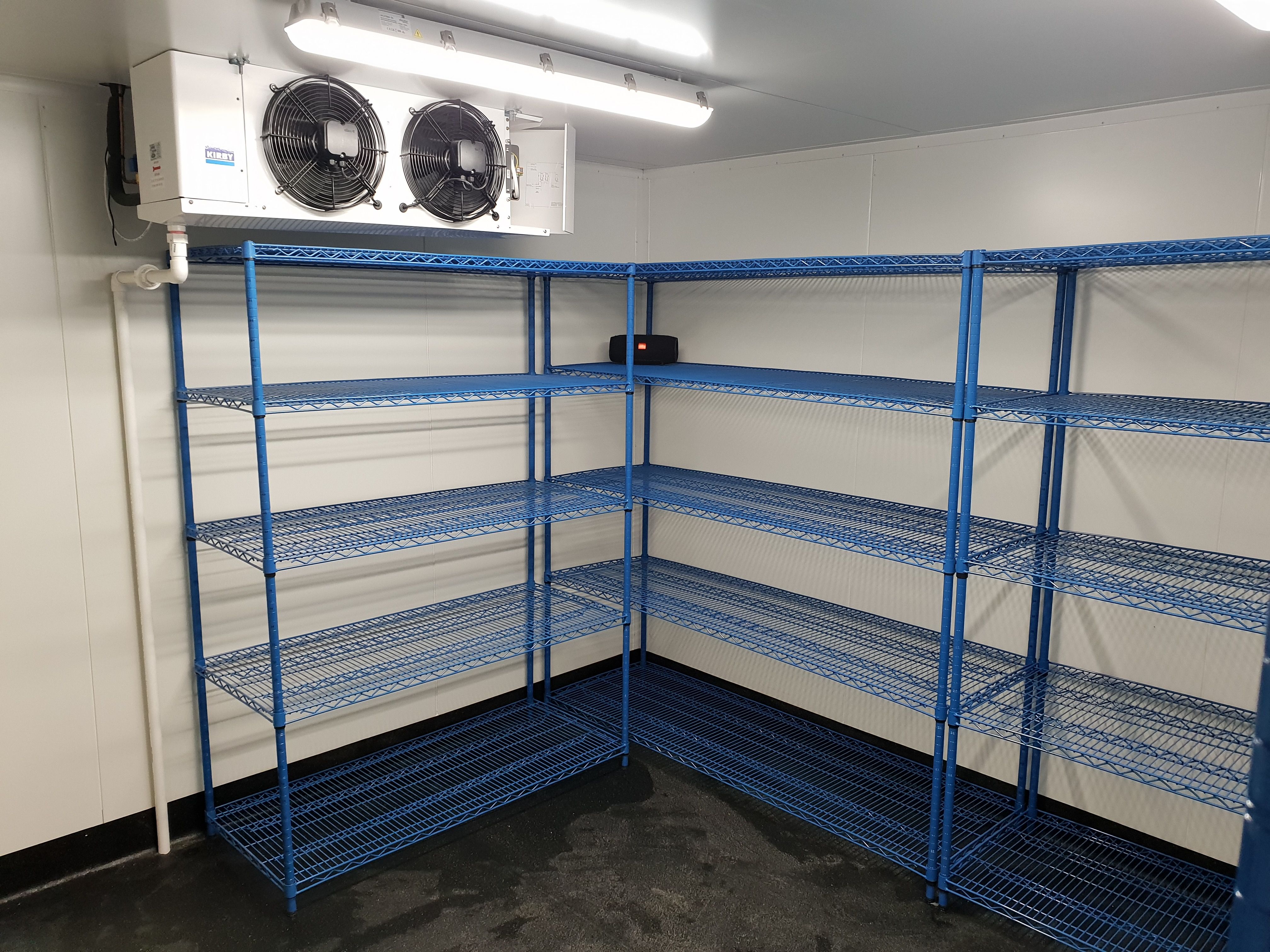 Commercial coolroom interior — corner shelving unit