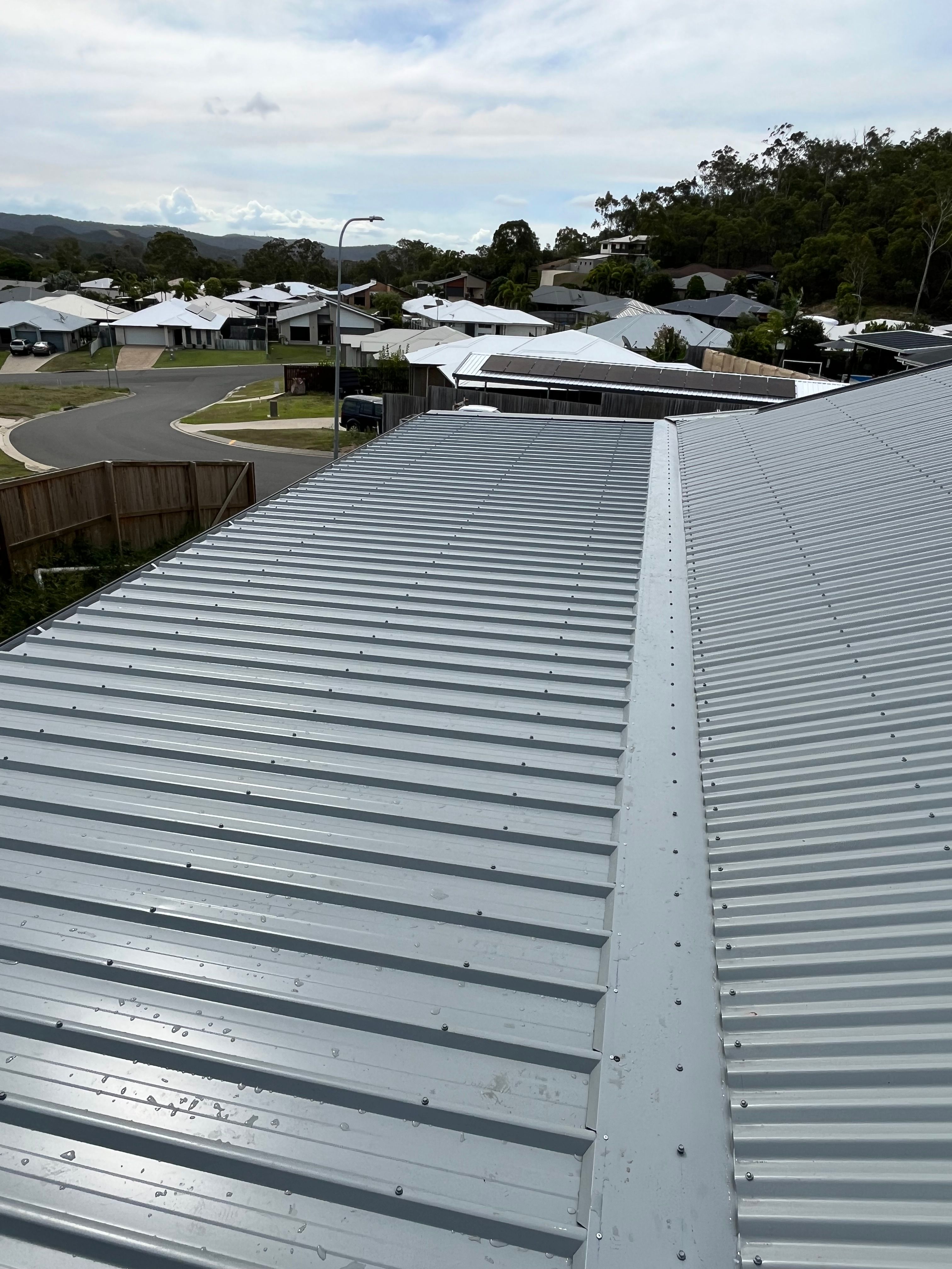 Completed metal re-roof on Queensland home by M.C Roofing