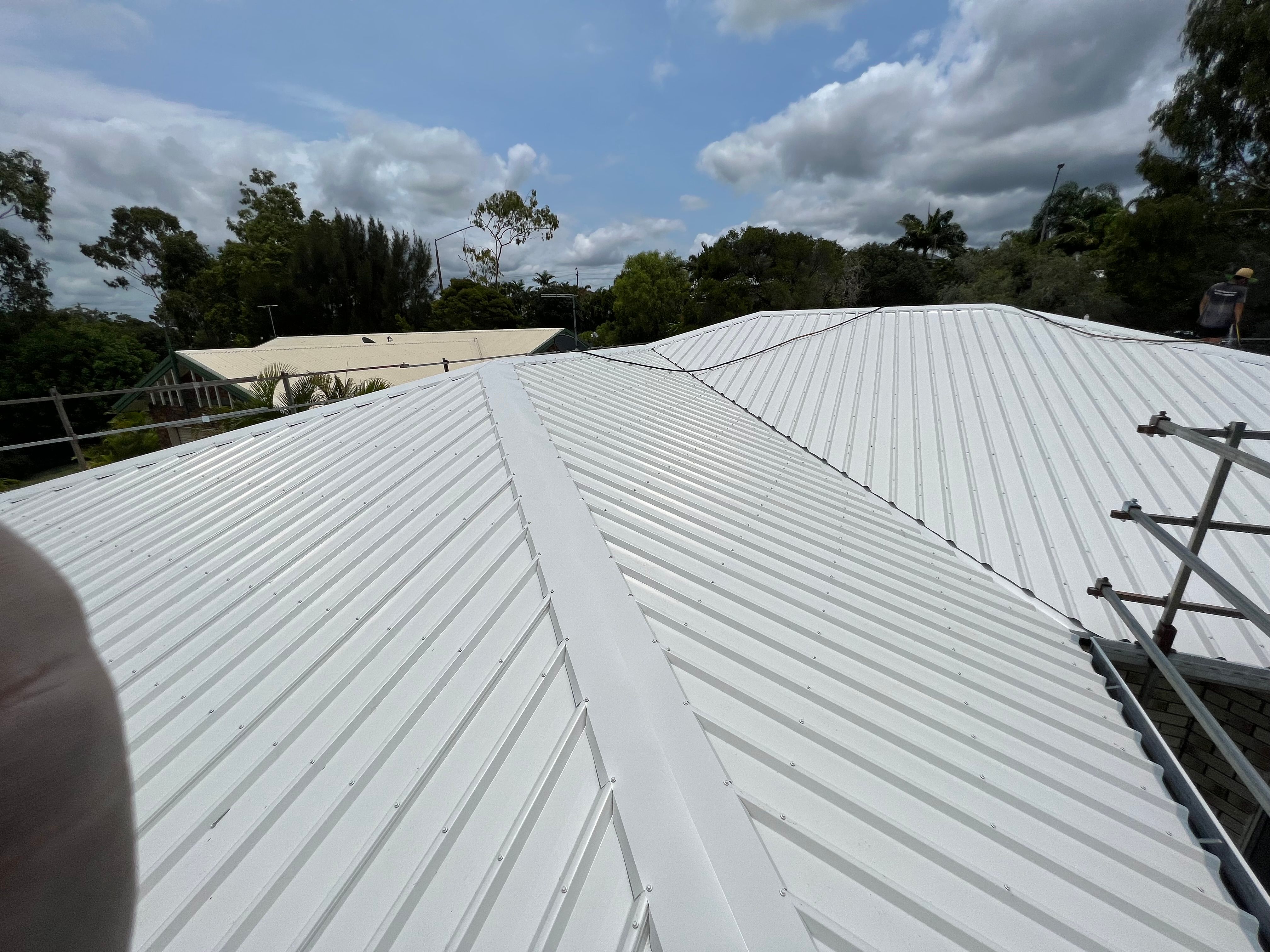 Metal roof with ridge capping